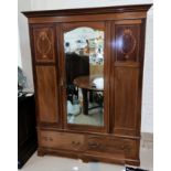 An Edwardian inlaid mahogany single door wardroe with base drawer and near matching dressing table