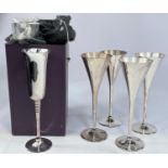 Four boxed John Lewis conical shaped silver plated wine glasses, four more silver plated champagne