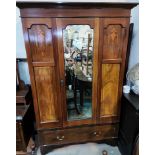 An Edwardian inlaid mahogany wardrobe with central mirror drawers and 2 base drawers; similar bed