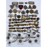 A selection of military badges and buttons etc