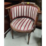 An Edwardian inlaid mahogany tub chair in regency stripe