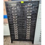 A metal stationery cabinet with 30 drawers