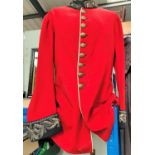 A vintage dragoons red jacket with silver thread embroidery to collar and sleeves