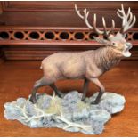 A Border Fine Arts group:  Highland Majesty, on rocks, signed Roberts, height 28cm, length 32cm