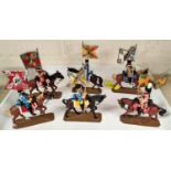 Six miniature painted soldiers bearing flags on horseback by Charles Stadden