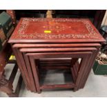 A nest of brass and mahogany inlaid tables