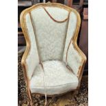 A 19th century Louis XV style gilt framed wing back armchair on cabriole legs (requires renovation)