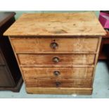 A small pine chest of drawers.