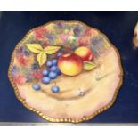 A Royal Worcester shaped circular dish hand painted with apples; grapes; etc., gilt edges, signed