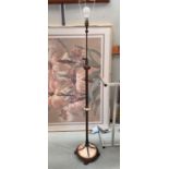 A brass telescoping standard lamp with marble base and claw feet