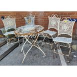 French style cast metal bistro set comprising table and 4 chairs