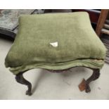 A Victorian carved walnut stool with box seat in green; a piano stool with hinged lid and fretwork