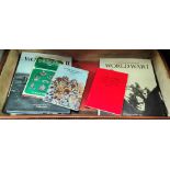 A selection of books on military badge collecting, other military subject and a     case etc