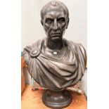 A bust of Julius Caesar in black basalt finish, height 64cm