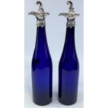 A pair of Bristol blue wine bottles with silver pouring spout mounts, Sheffield 1843, and matching