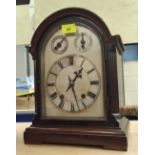 A 1920's 8 day mantel clock with arched silvered dial, in mahogany case, 33cm