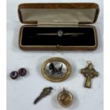 A 9ct hallmarked gold, stone set, Celtic cross; a bar brooch with blue stones, stamped 9ct, 8.3gms &