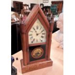 A late 19th century American arch top mahogany mantel clock with striking movement