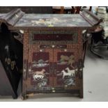 A modern Chinese altar cabinet comprising double cupboard and frieze drawer, decorated with