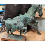 Two 'Tang' style horses on wooden plinths, lengths 47 & 31cm
