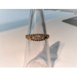 An Edwardian 18 carat hallmarked gold split shank ring with 3 diamonds