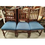 An Edwardian set of 4 Arts & Crafts style dining chairs with high backs