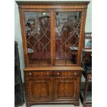 A reproduction figured mahogany full height display cabinet in the Georgian style with 2 glazed