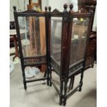 An Edwardian mahogany 3-fold screen with glass panels and pierced fretwork decoration, on turned