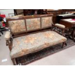 An Edwardian inlaid mahogany 2 seater settee in floral fabric