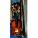 A three quarter size violin with 2 bows, cased, with music and music stand