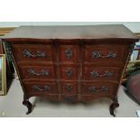 A late 19th early 20th century Louis XV style walnut serpentine front, 3 height chest of drawers