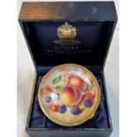A Royal Worcester hand painted covered pot, limited edition, in red and gilt, decorated with fruit