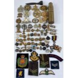 A selection of various military badges etc, with trench art shell