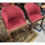 A 1930's pair of oak armchairs in studded burgundy; a similar prie dieu chair