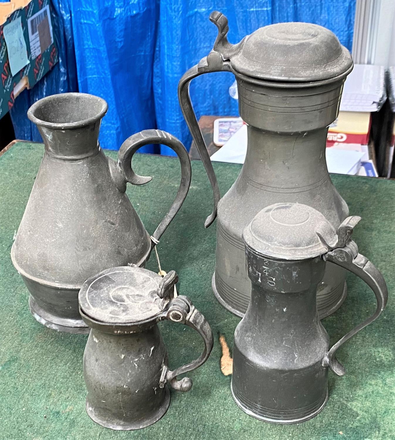 Four various 'tappit hen' style pewter jugs