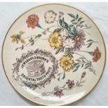 A stoneware 'Jewsbury & Brown's Oriental Toothpaste'  advertising plate decorated with flowers,