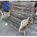 A Victorian Coalbrookdale style garden bench with naturalistic vine ends (a couple of slats a.f.)