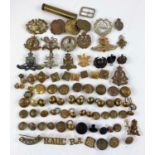 A selection of military badges and buttons etc
