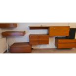 A 1960's/70's teak wall unit comprising a large quantity of 'floating' sections including display