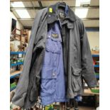 A Barbour Wax Jacket in black, approx. large; a Barbour International Jacket in blue, XL