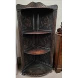 A Victorian carved oak 4 height corner shelf unit