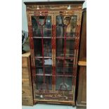 A modern Chinese display cabinet with 2 doors, red lacquer with mother-of-pearl decoration