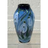 A modern Moorcroft ovoid vase decorated with snowdrops against a blue ground, impressed and dated