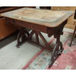 A 19th century Arts & Crafts pitch pine writing table with frieze drawers, on pierced legs and