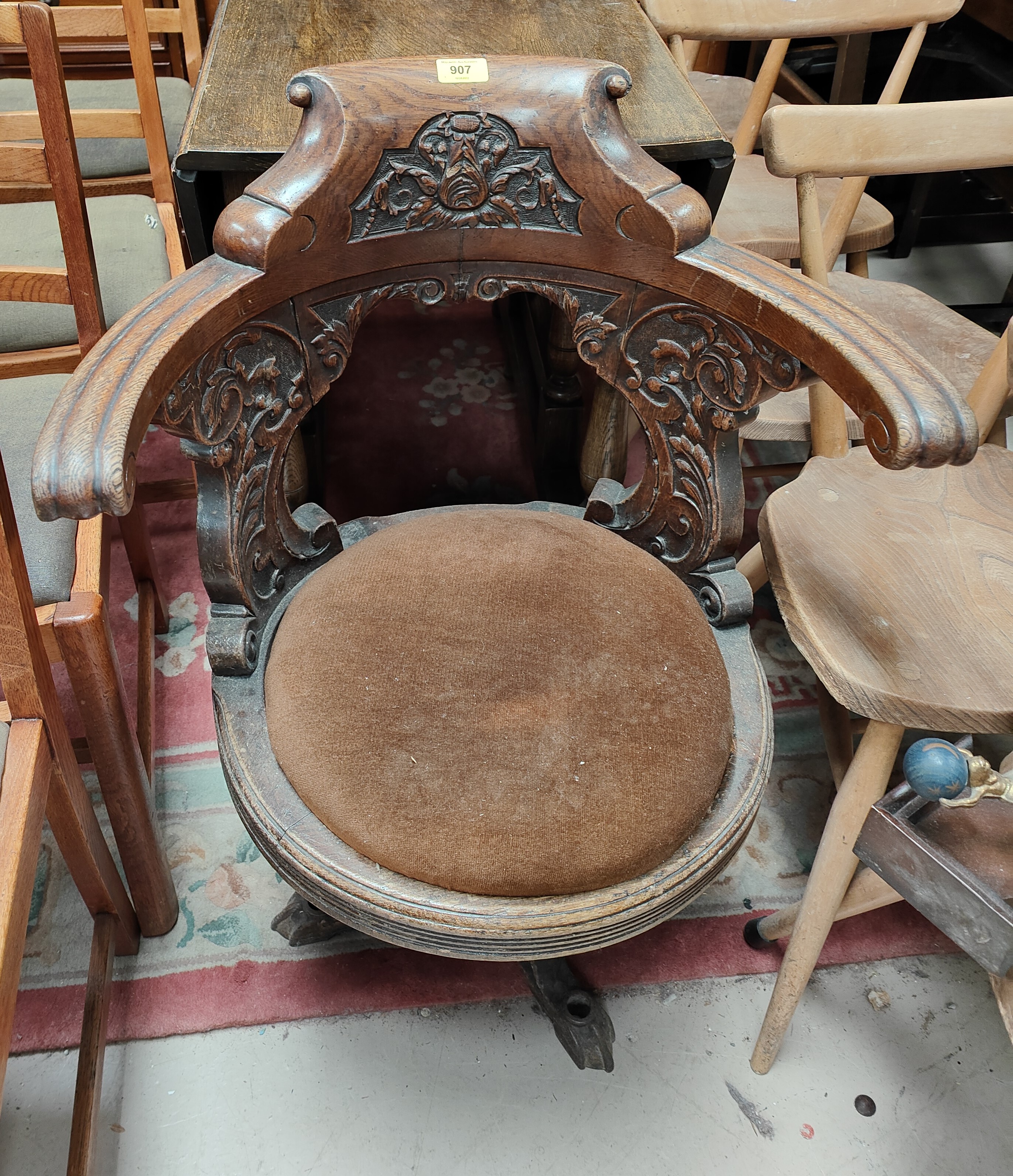 A late 19th/early 20th century ships captain chair in carved oak on cast iron base - Image 2 of 3