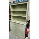 A painted pine dresser with cupboard and drawers below.