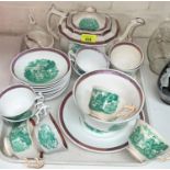 A 19th century Sunderland lustre part tea set decorated with green transfer harvest scene:  teapot