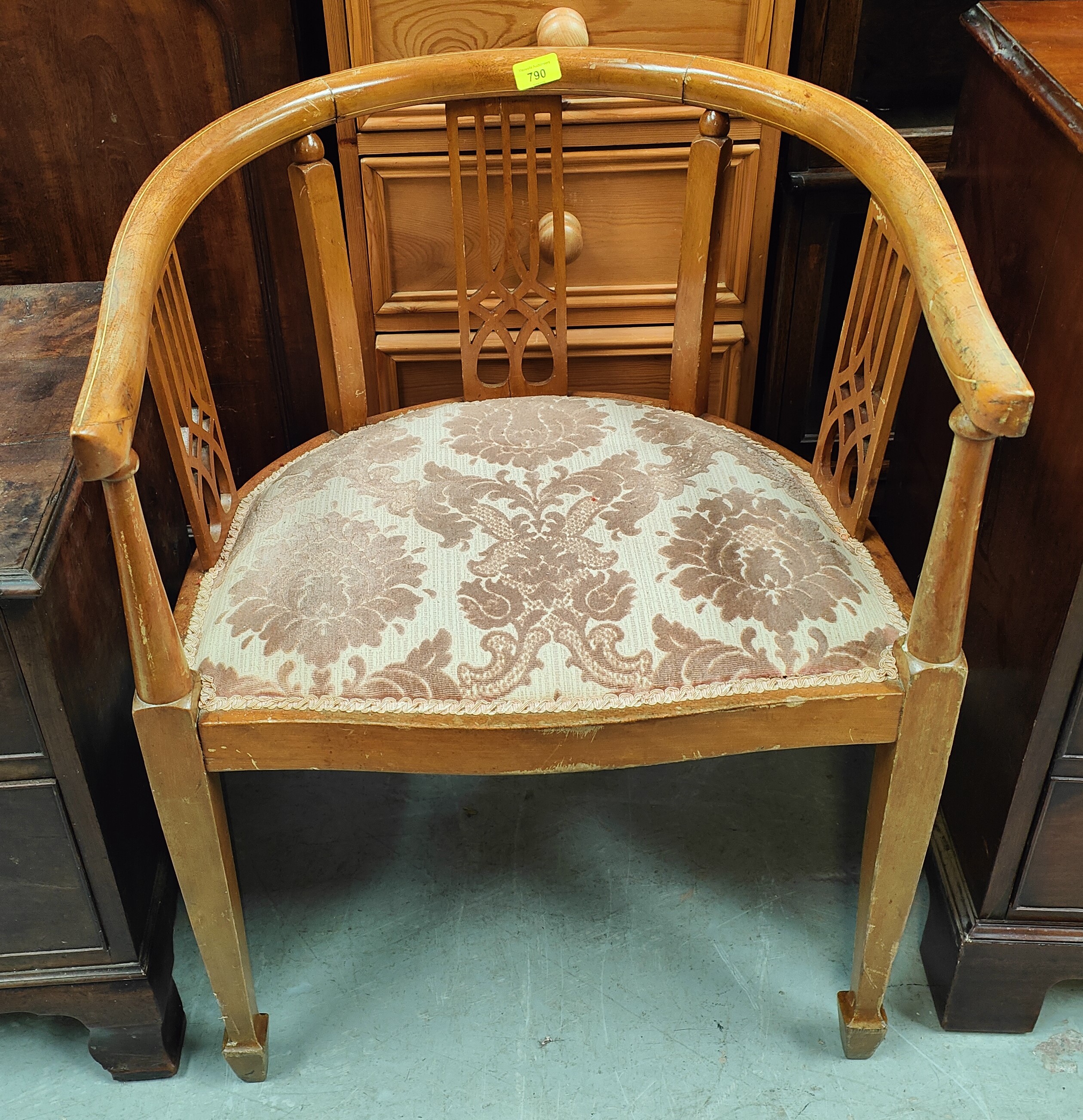 An Edwardian inlaid mahogany tub chair