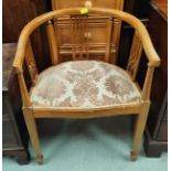 An Edwardian inlaid mahogany tub chair