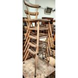 A set of five Ercol light elm stacking dining chairs with bar backs (some woodworm in need of a